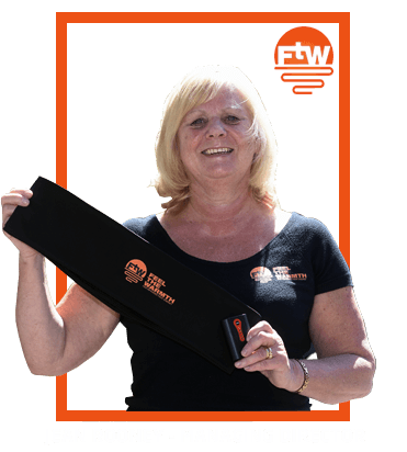 Jean Rooney holds the first generation FTW belt.